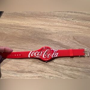 Coca-Cola plastic watch, with red and white design logo.
